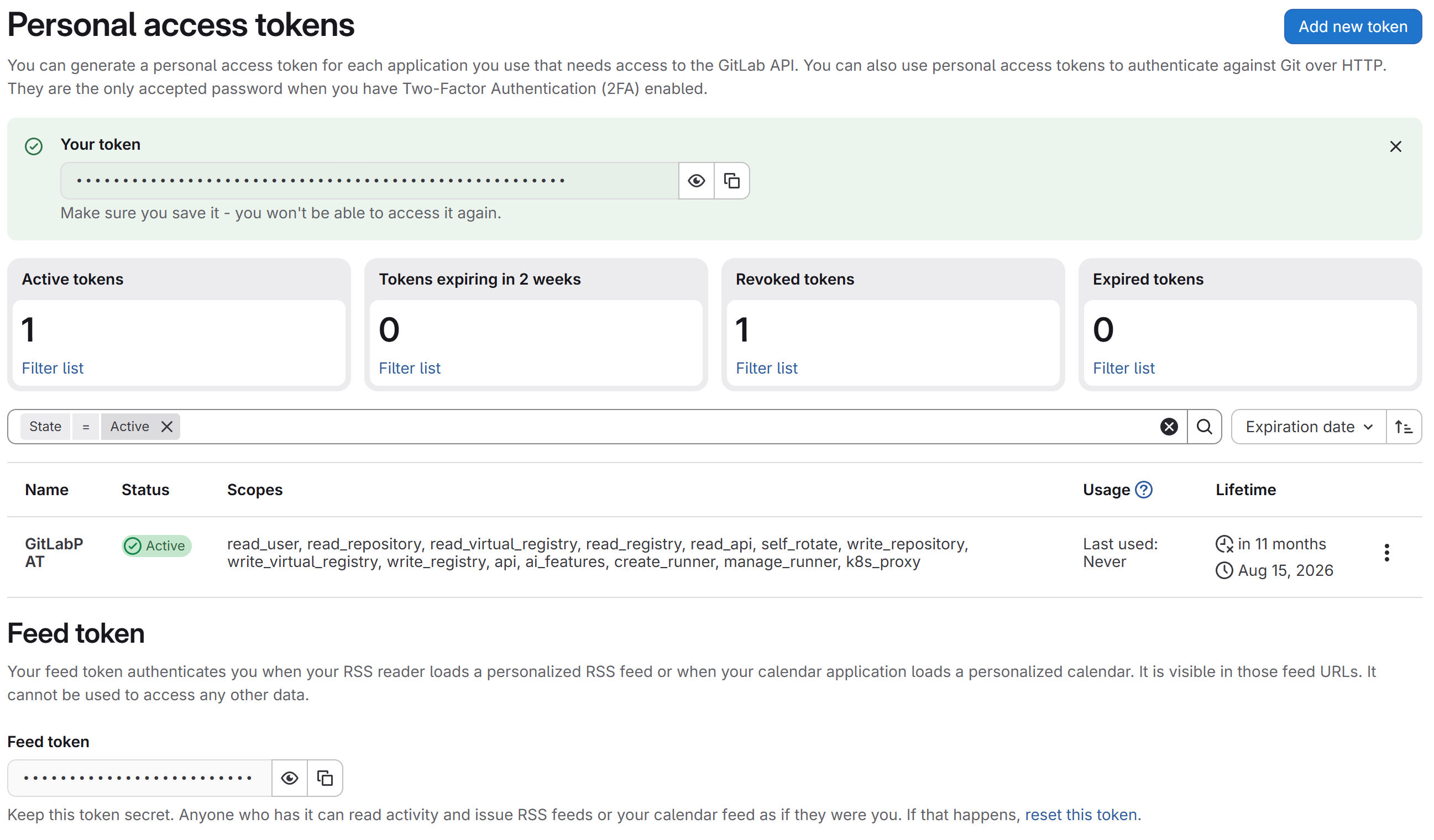 Personal access tokens page showing a green banner with the generated token and a warning to save it now